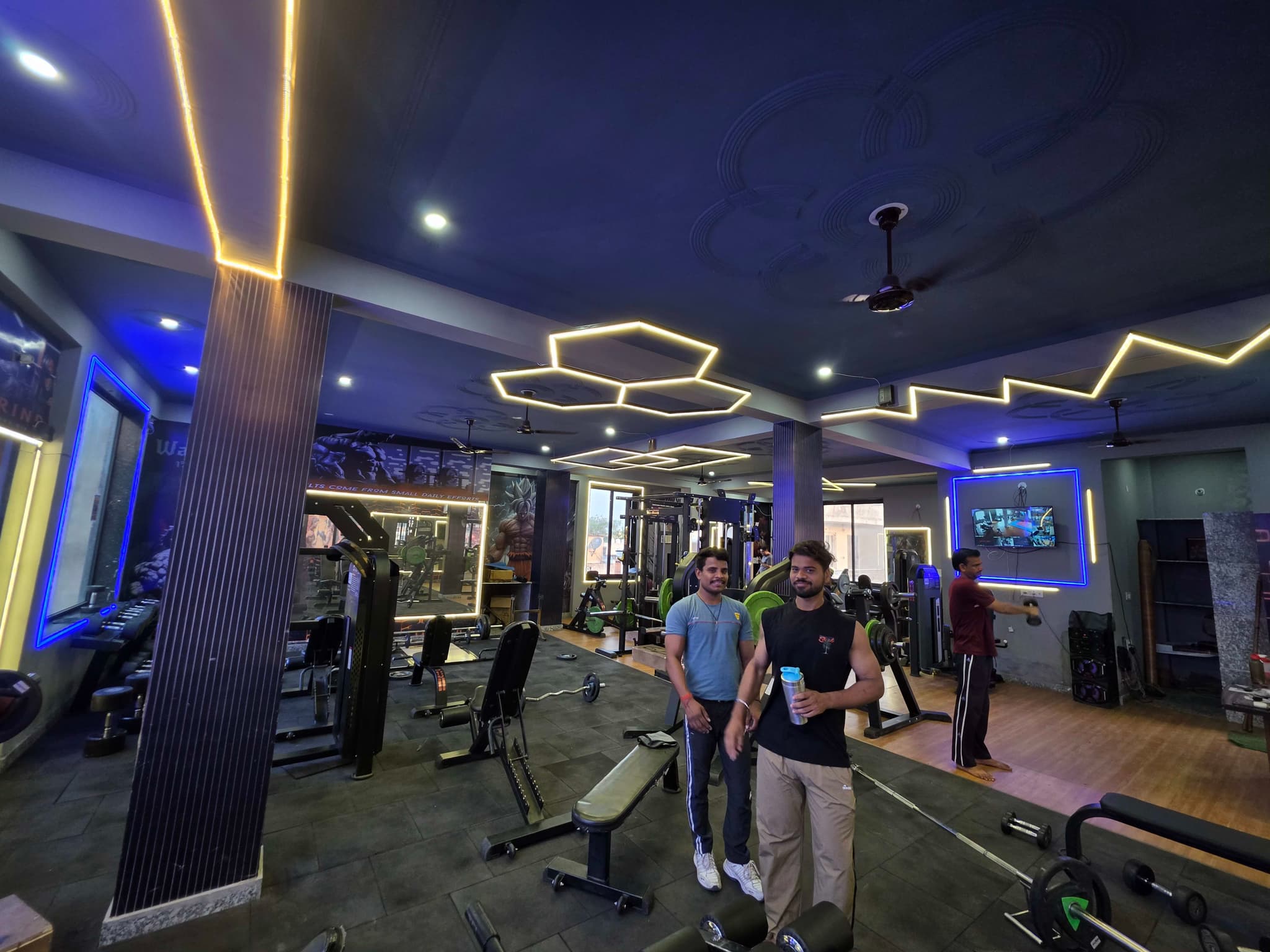 Two members posing together on the training floor at G2 Fitness Club